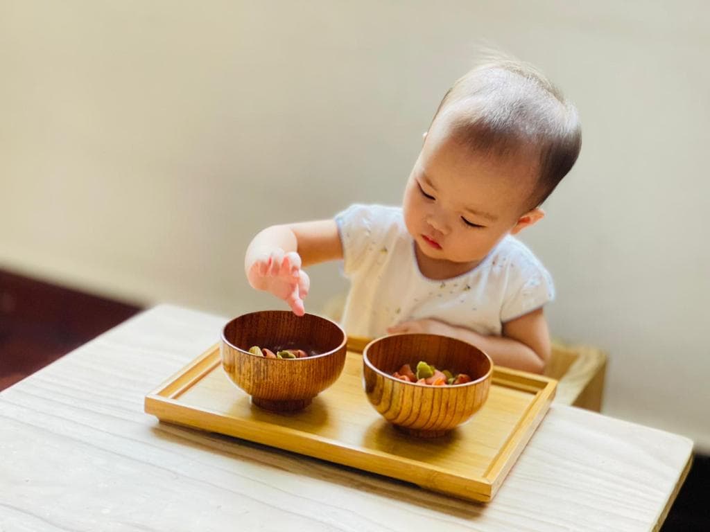 Child doing montessori work in a classroom